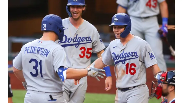 Cody Bellinger #35 and Will Smith #16 congratulate Joc Pederson #31 after hitting a 3-run homer. (Getty)
