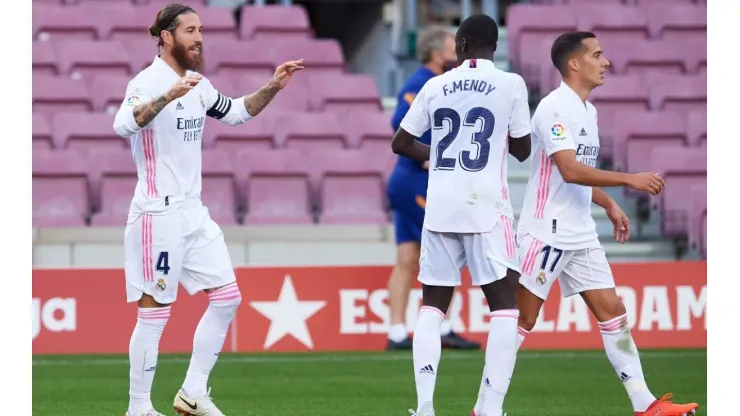 Sergio Ramos (left) celebrates after scoring against Barcelona. (Getty)
