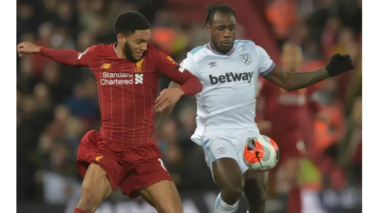 Michail Antonio of West Ham United (right) in action with Joe Gomez of Liverpool (left). (Getty)
