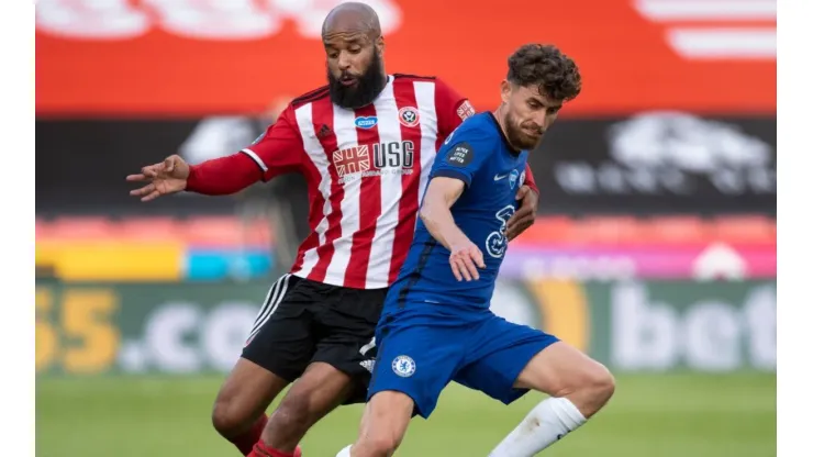 Jorginho of Chelsea and David McGoldrick of Sheffield United. (Getty)
