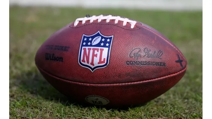 A detailed view of the NFL logo on a football prior to a game.
