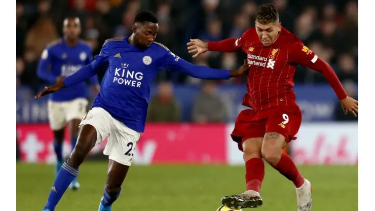 Roberto Firmino (right) and Wilfred Ndidi (left) in action during the Premier League match between Leicester City and Liverpool. (Getty)
