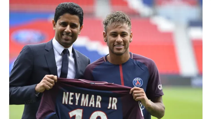 Neymar poses with his new jersey next to Paris Saint-Germain President Nasser Al-Khelaifi after a press conference on August 4, 2017 in Paris, France (Getty Images).
