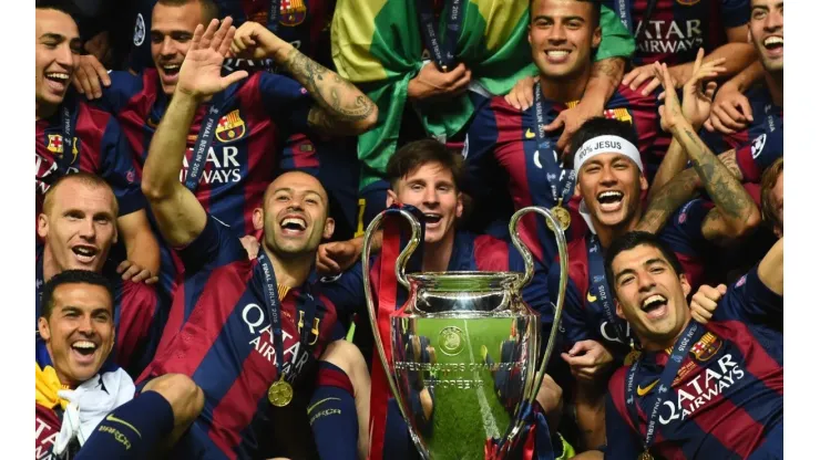 Barcelona players including Javier Mascherano, Lionel Messi, Neymar and Luis Suarez celebrate victory with the trophy after the UEFA Champions League Final between Juventus and FC Barcelona (Getty Images).
