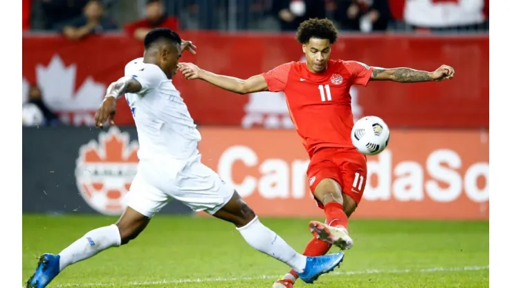 Tajon Buchanan #11 of Canada has a shot on goal
