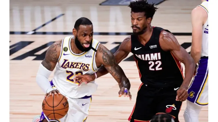 LeBron James of Los Angeles Lakers (left) tries to pass drible Jimmy Butler of the Miami Heat during the 2020 NBA Finals
