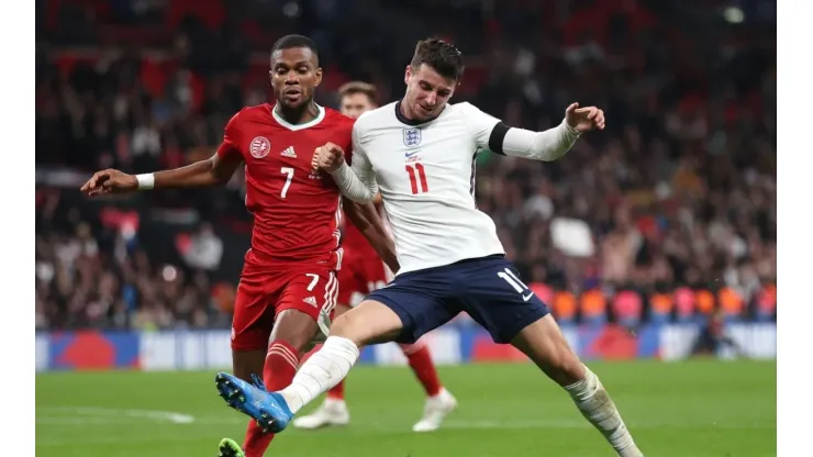 Mason Mount of England battles for possession with Loic Nego of Hungary
