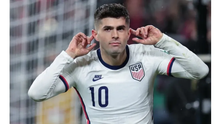 Christian Pulisic celebrates after scoring against Mexico.
