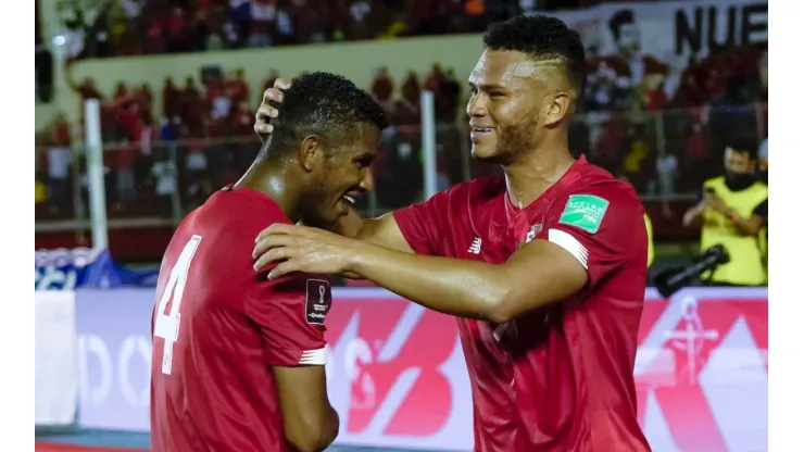 Rolando Blackburn of Panama celebrates with teammate Fidel Escobar.
