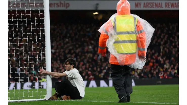 Man holds on to the post
