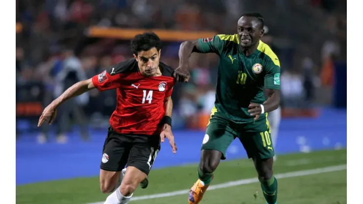 Omar Gaber of Egypt and Sade Mane of Senegal compete for the ball during the FIFA World Cup Qatar 2022 qualification
