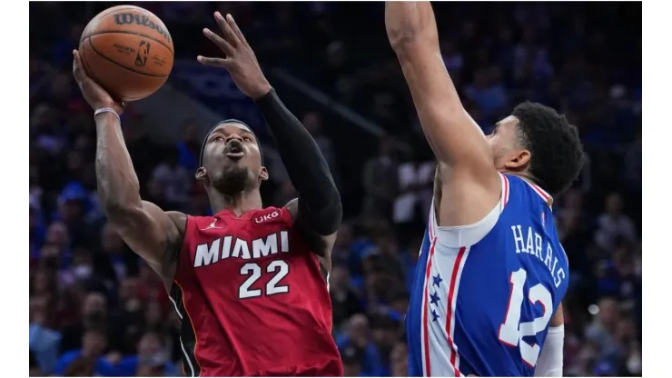 Jimmy Butler of the Miami Heat shoots the ball against Tobias Harris of the Philadelphia 76ers
