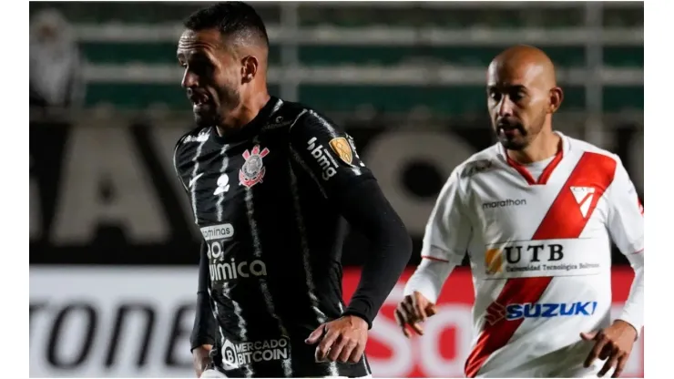 Renato Augusto of Corinthians (R) fights for the ball with Marco Riquelme of Always Ready
