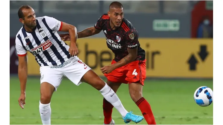 Jonatan Maidana of River Plate fights for the ball with Hernan Barcos of Alianza Lima
