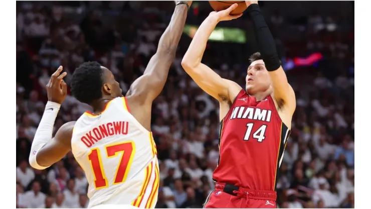 Tyler Herro of the Miami Heat shoots over Onyeka Okongwu of the Atlanta Hawks
