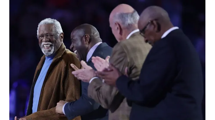 Former NBA players Bill Russell (L) and Earvin "Magic" Johnson Jr. react as they are honored during the 2017 NBA All-Star Game
