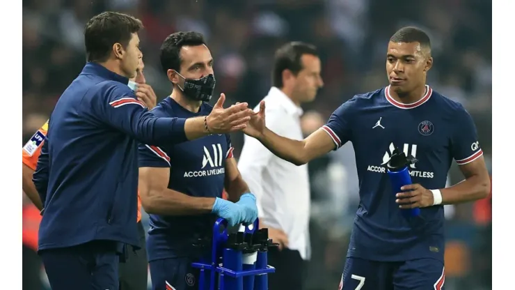 Mauricio Pochettino (left) and Kylian Mbappe.
