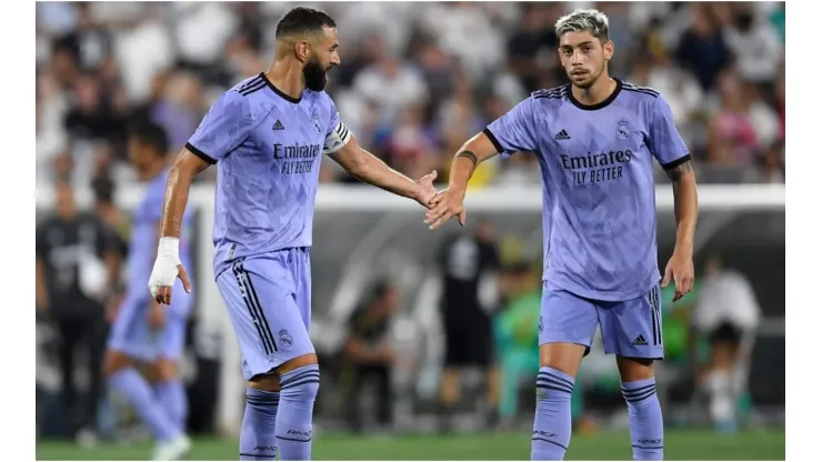 Karim Benzema of Real Madrid shakes hands with Federico Valverde
