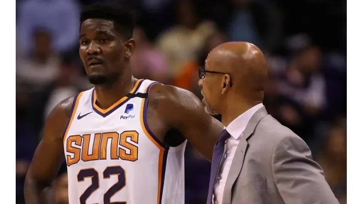 DeAndre Ayton of the Phoenix Suns stands with head coach Monty Williams
