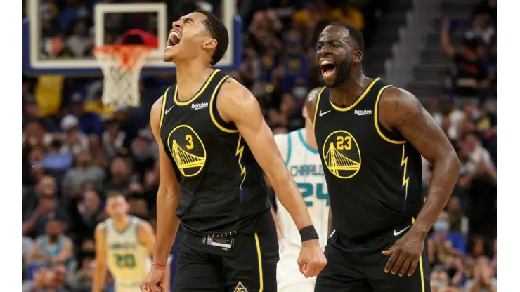 Jordan Poole (left) and Draymond Green.
