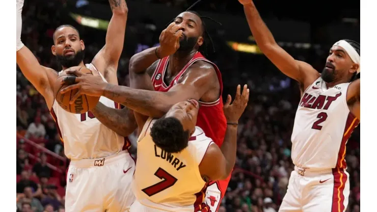 Andre Drummond of the Chicago Bulls fouls Kyle Lowry of the Miami Heat
