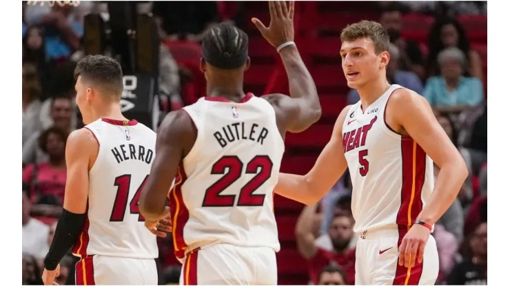 Nikola Jovic of the Miami Heat is congratulated by Jimmy Butler
