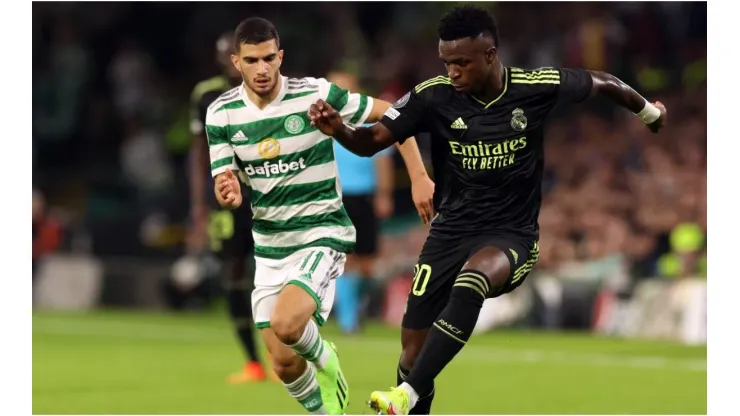 Vinicius Junior of Real Madrid evades Liel Abada of Celtic
