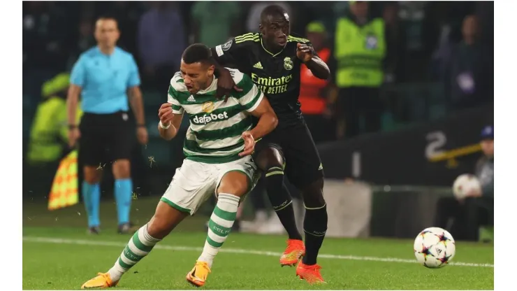 Giorgos Giakoumakis of Celtic battles for possession with Ferland Mendy of Real Madrid
