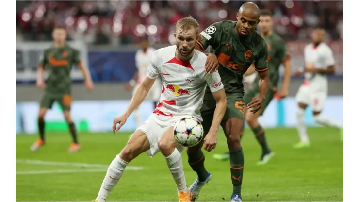 Konrad Laimer of RB Leipzig battles for possession with Lucas Taylor of Shakhtar Donetsk
