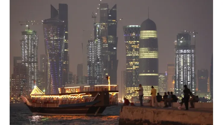 People fish along the waterfront along the Persian Gulf in Doha, Qatar.
