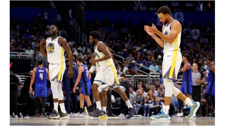 Draymond Green, Stephen Curry, and Andrew Wiggins
