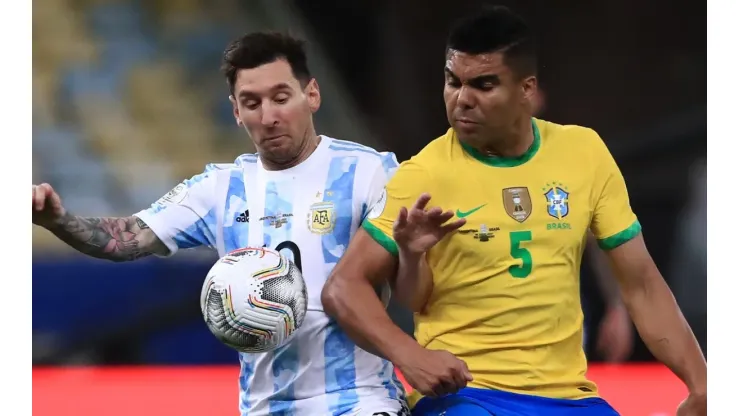 Messi (left) of Argentina fighting for ball control against Casemiro of Brazil
