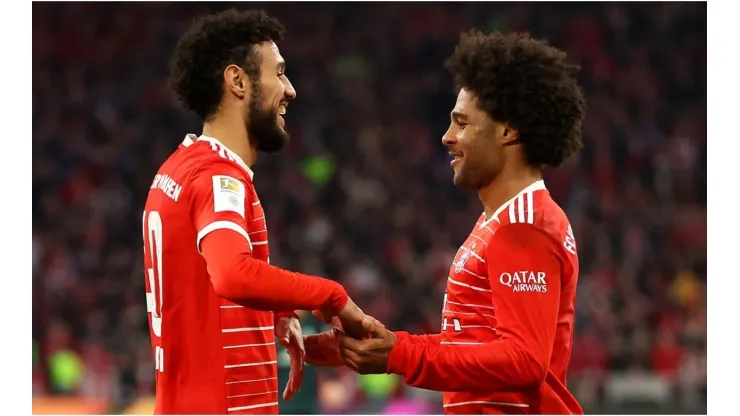 Serge Gnabry celebrates with Noussair Mazraoui of Bayern Munich
