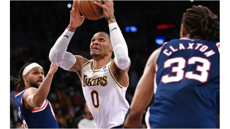 Russell Westbrook of the Los Angeles Lakers is defended by Patty Mills and Claxton of the Brooklyn Nets
