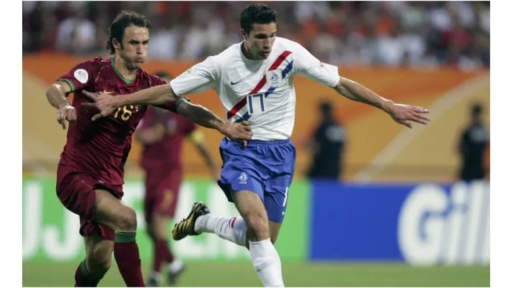 Robin Van Persie (R) of the Netherlands holds off Ricardo Carvalho of Portugal during the FIFA World Cup Germany 2006
