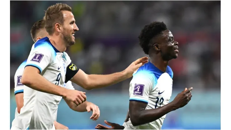 Bukayo Saka (R) of England celebrates scoring his team's fourth goal
