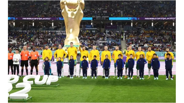 Australian players stand for the national anthem
