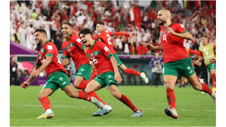 Morocco players celebrate after the team's victory in the penalty shoot out
