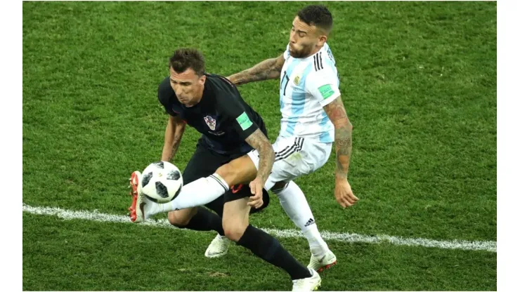 Mario Mandzukic of Croatia is tackled by Nicolas Otamendi of Argentina
