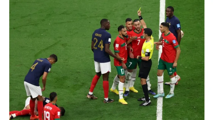 Sofiane Boufal of Morocco is shown a yellow card by Referee Cesar Arturo Ramos
