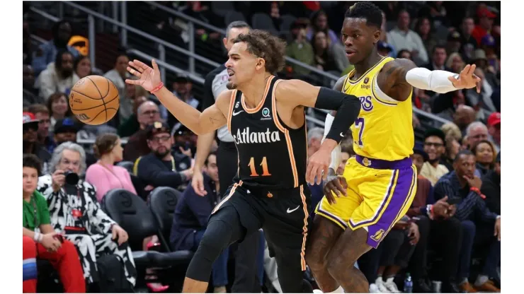 Trae Young of the Atlanta Hawks loses the ball as he drives against Dennis Schroder of the Los Angeles Lakers
