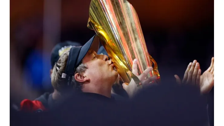 HC Kirby Smart of the Bulldogs kissing his second back-to-back CFP title
