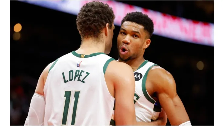 Brook Lopez #11 reacts with Giannis Antetokounmpo #34 of the Milwaukee Bucks
