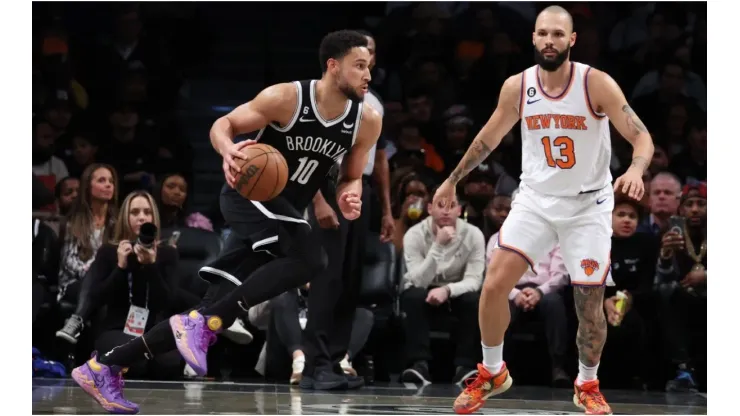 Ben Simmons #10 of the Brooklyn Nets drives against Evan Fournier #13 of the New York Knicks
