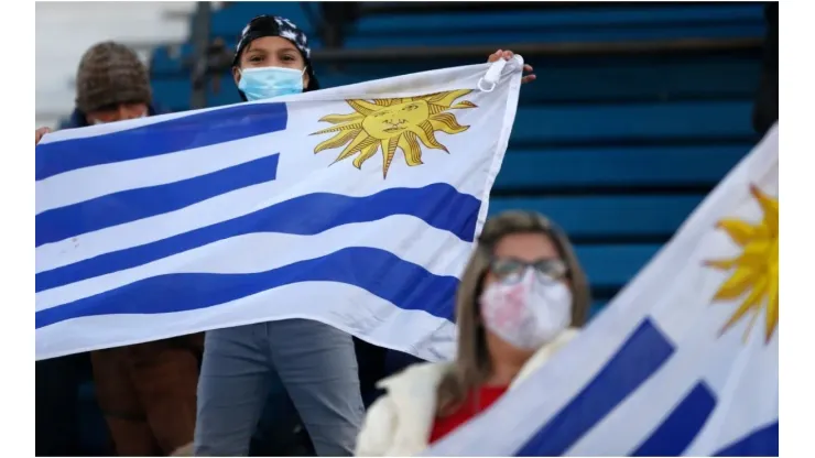 Fans of Uruguay wave flags
