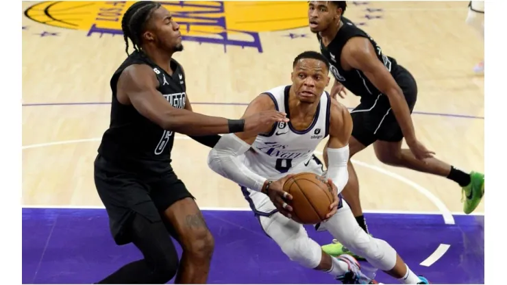 Russell Westbrook #0 of the Los Angeles Lakers drives to the basket against David Duke Jr. #6 of the Brooklyn Nets
