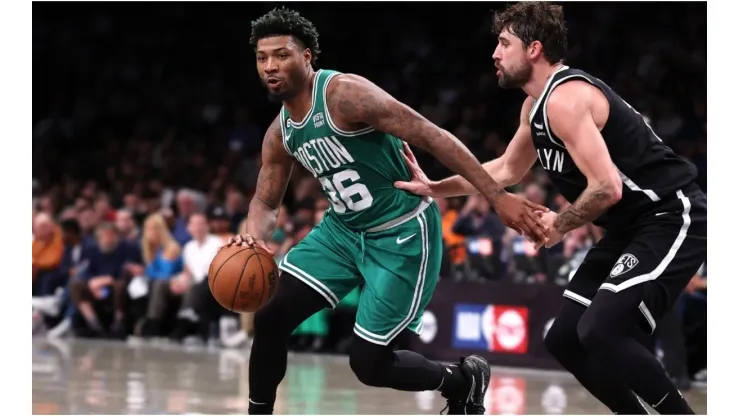 Marcus Smart #36 of the Boston Celtics drives against Joe Harris #12 of the Brooklyn Nets
