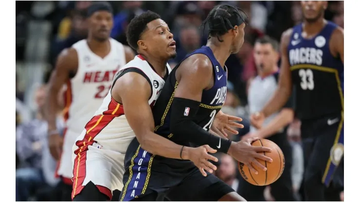 Kyle Lowry #7 of the Miami Heat defends Buddy Hield #24 of the Indiana Pacers
