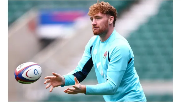 England Captain's Ollie Chessum passes the ball during a training session
