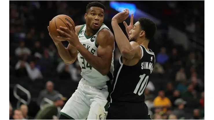 Giannis Antetokounmpo #34 of the Milwaukee Bucks is defended by Ben Simmons #10 of the Brooklyn Nets
